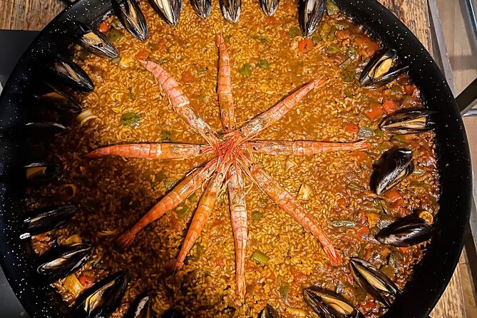 Barcelona Authentic Paella and Sangria Cooking Class - Preparing paella with help from the chef