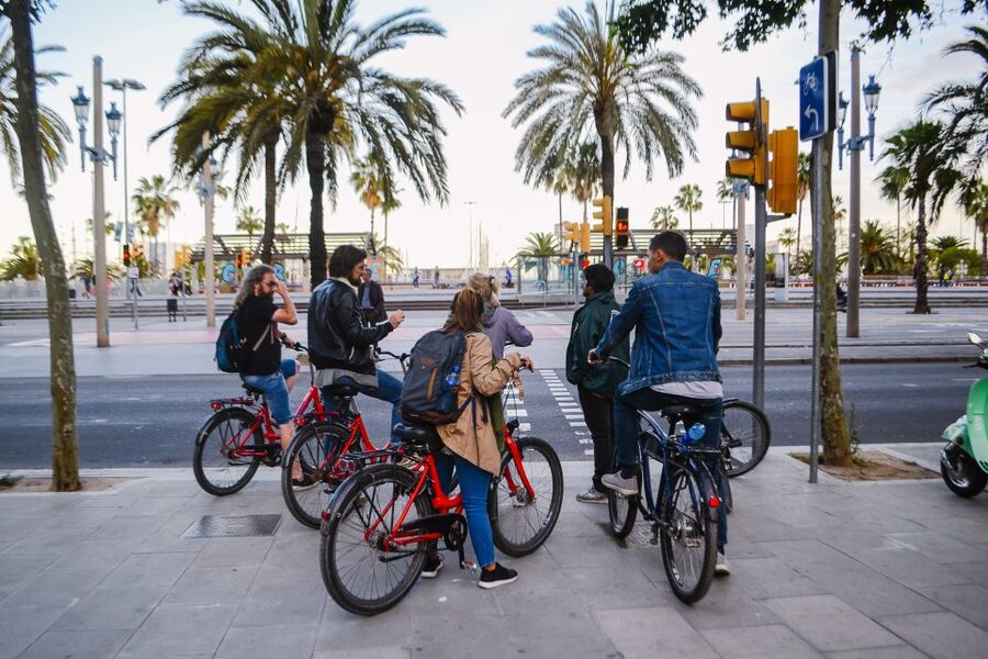 Barcelona Bike Tour by Night with Cava - Raval and Eixample show two sides of the city
