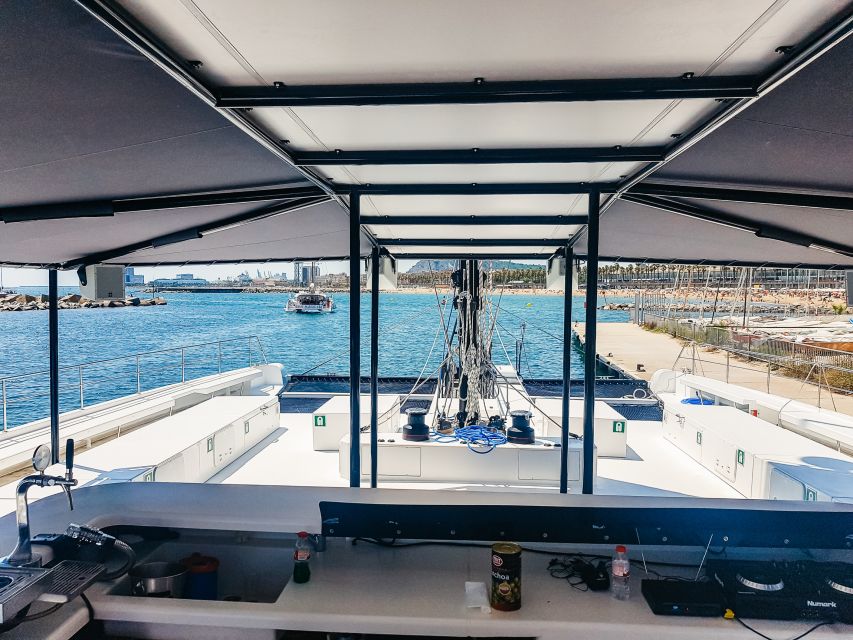 Barcelona: Catamaran Party Cruise with BBQ Meal - The swimming stop and Mediterranean water