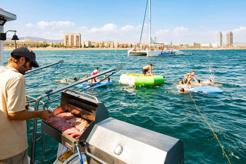Barcelona: Catamaran Party Cruise with BBQ Meal - Meeting the catamaran near Port Olímpic