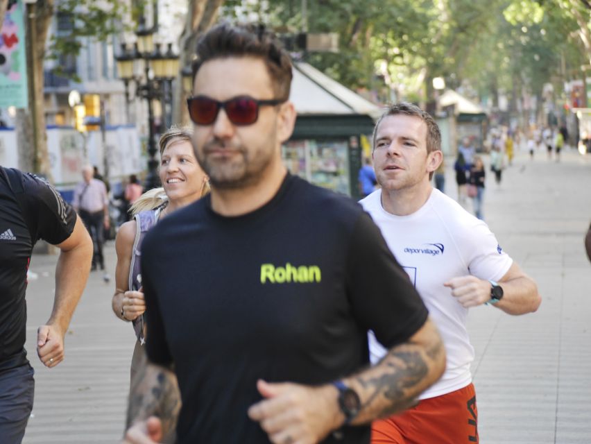 Barcelona: City Highlights Guided Running Tour - The Sagrada Família as the main landmark stop