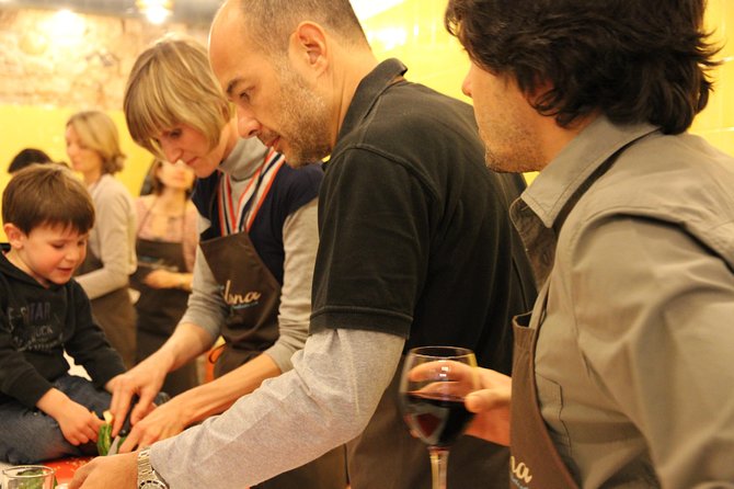 Barcelona Culinary Experience: Paella & Tapas Cooking Class - Wine, snacks, and a social kitchen