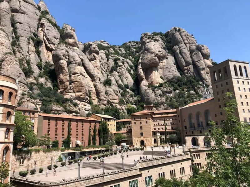 Barcelona: Montserrat Tour with Transport & Basilica Option - Meeting in central Barcelona and riding into the hills