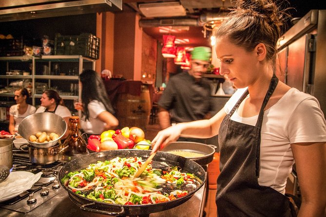 Barcelona : Paella Cooking Experience + Boqueria Market Exclusive Tour - Taking your turn at the paella pan