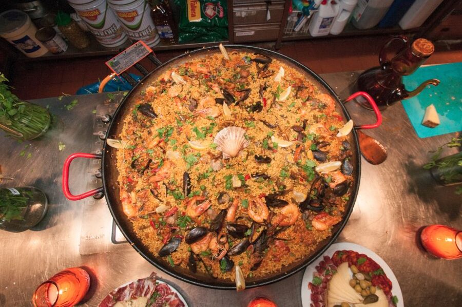 Barcelona: Paella Cooking Experience & Boqueria Market Tour - Building a seafood paella around one large pan