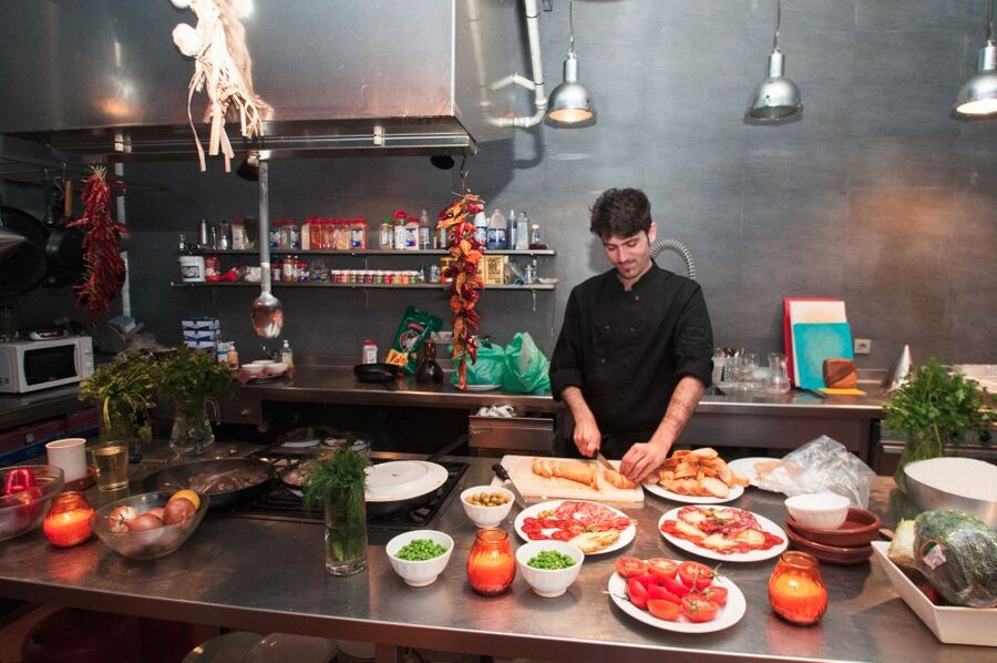 Barcelona: Paella Cooking Experience & Boqueria Market Tour - Sitting down to eat what the group made