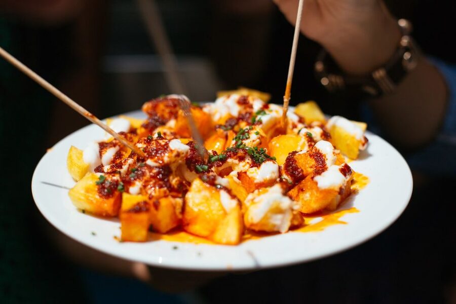 Barcelona: Private Food Tour – 10 Tastings with Locals - Walking through Barcelona’s food neighborhoods