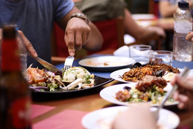 Barcelona Private Food Tour: Tapas, Paella & 8+ Food Tastings - Eating your way from jamón to paella