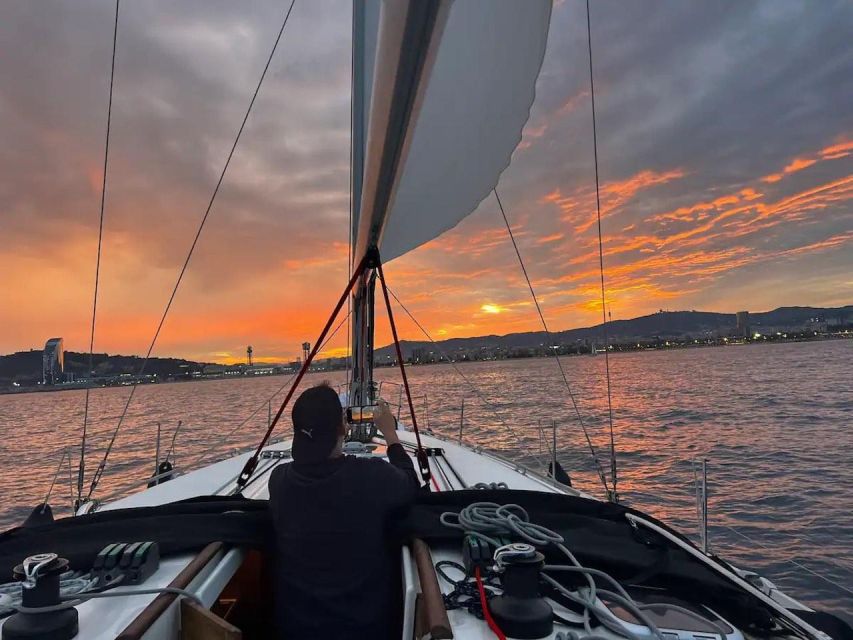 Barcelona: Sailing Tour with a Glass of Cava - Hoisting the mainsail toward the November Buoy