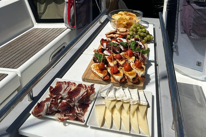 Barcelona: Sailing Tour with Tapas, Drinks, Swim & Sunset Option - Cava, seafood tapas, and the social side