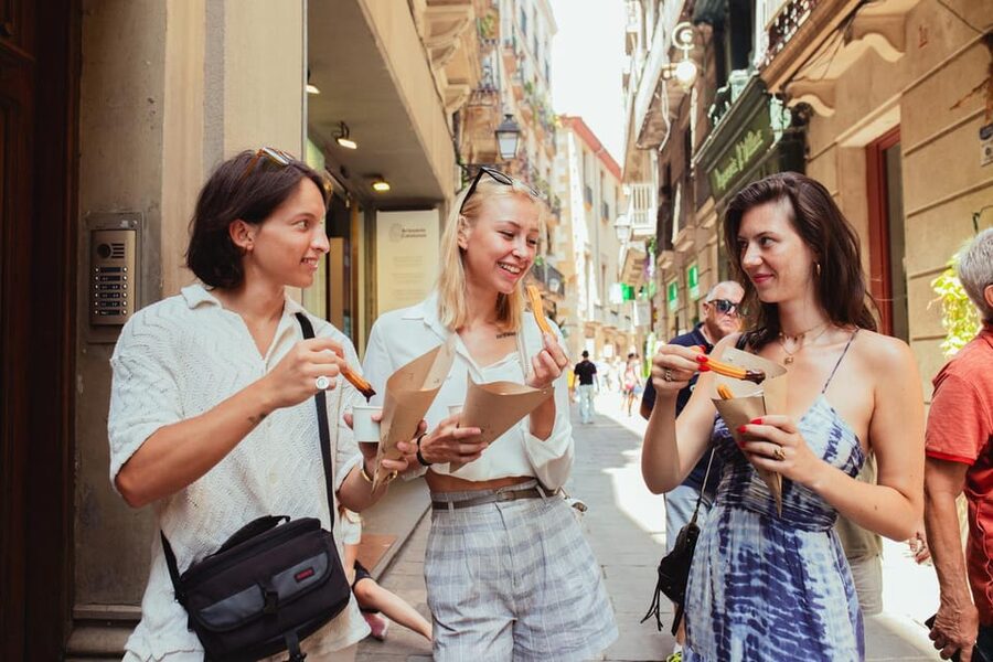 Barcelona: Small Group Gothic, Tapas & Churros Tour! - Starting at Plaça Catalunya with a pink umbrella