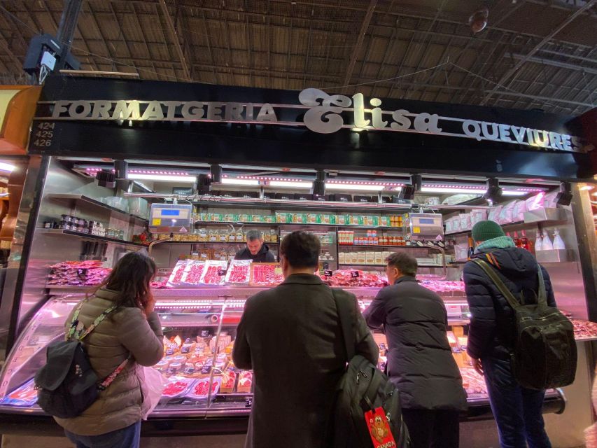 Barcelona: Street Food & Sightseeing Tour with Local Market - Walking through the Gothic Quarter