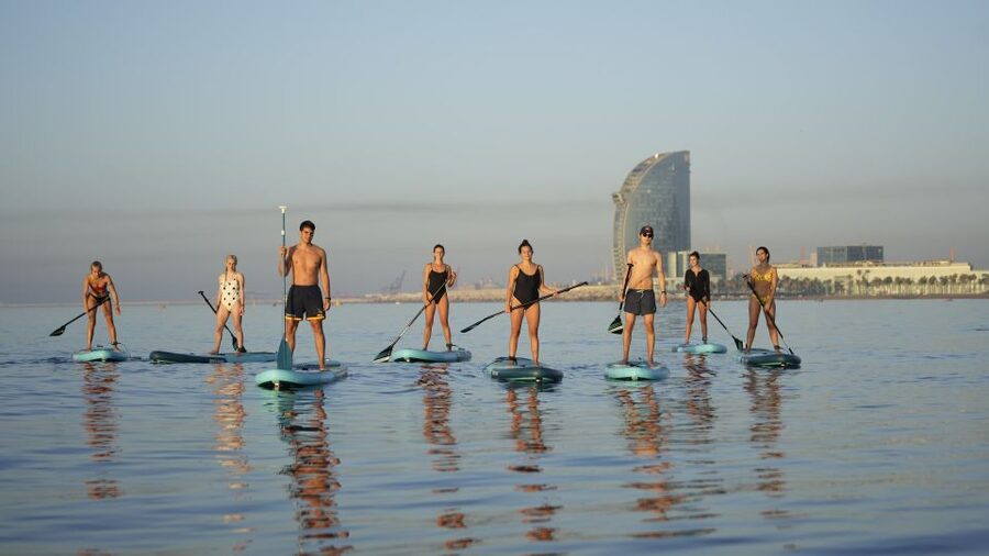Barcelona: Sunrise Paddleboarding with Instructor and Photos - Barceloneta Beach: a simple lesson before the water