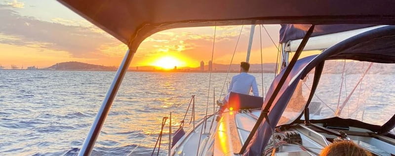 Barcelona: Sunset Boat Trip with Cava Wine and Snacks - Barcelona’s skyline from a sailboat at sunset