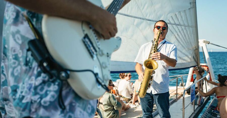 Barcelona: Sunset Catamaran Cruise with Live Music - Sailing the coast while Barcelona changes color