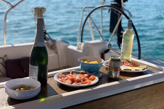 Barcelona Sunset Cruise with Light Snacks and Open Bar - Drinks, snacks, and what the open bar really means