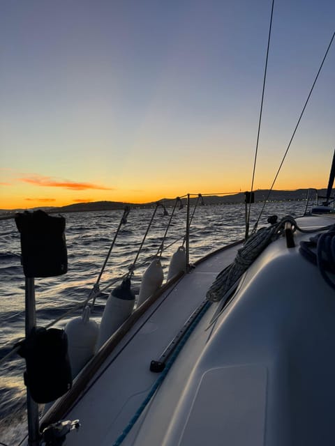 Barcelona: Sunset Sailboat Cruise with Drinks and Snacks - A sunset sail with Barcelona behind you