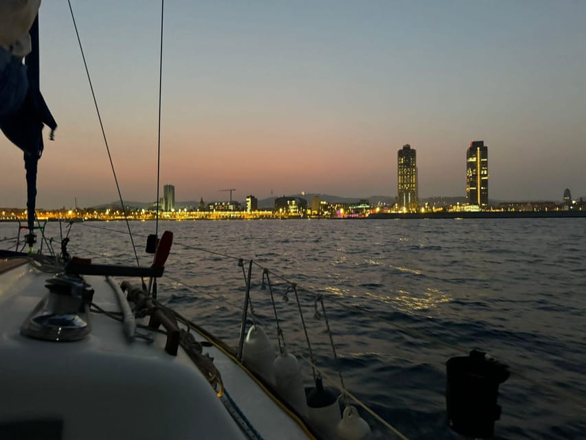 Barcelona: Sunset Sailboat Cruise with Drinks and Snacks - What happens during the one-hour cruise