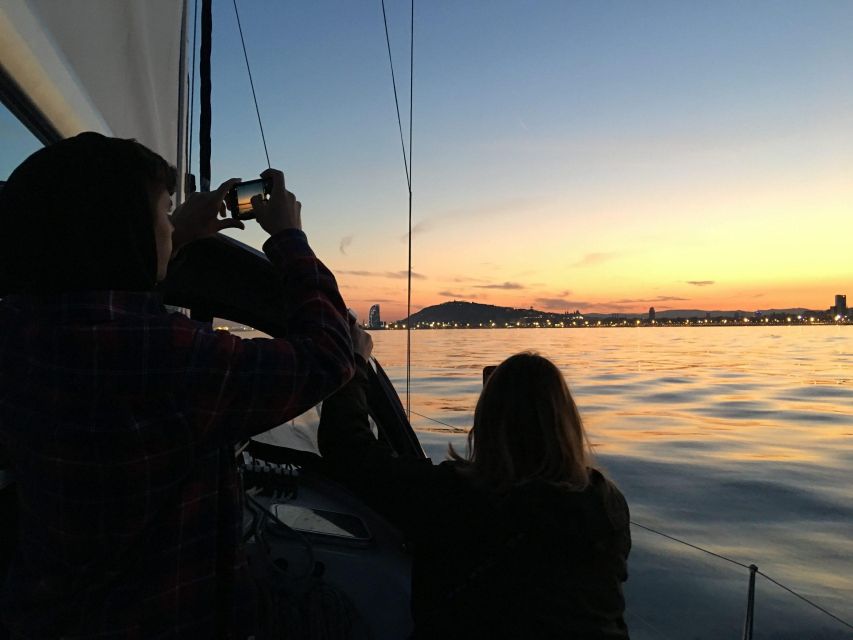 Barcelona: Sunset Sailboat Cruise with Open Bar and Snacks - Returning through Olympic Port