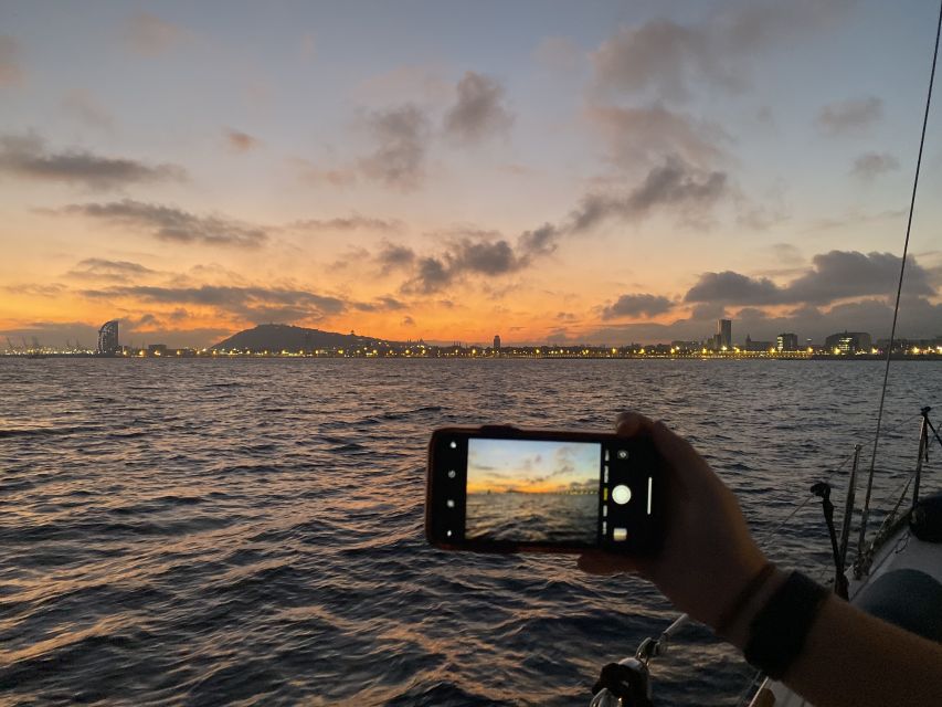 Barcelona: Sunset Sailing Tour with Open Bar & Snacks - Passing Marina Port Vell and watching the light change