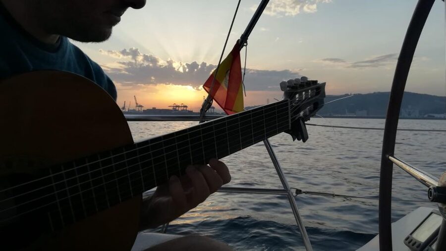 Barcelona: Sunset Sailing with Live Guitar Music and Tapas - Live Spanish guitar with the city behind you