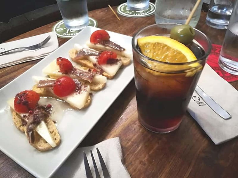 Barcelona: Tapas Crawl full meal & drinks all included - What the neighborhood setting adds
