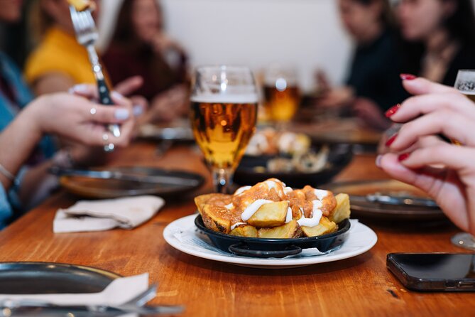 Barcelona Tapas Food Walking Tour with Wine in El Born - A 1945 bodega, vermouth, and the porrón