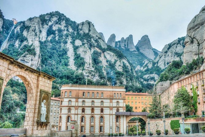 Barcelona to Montserrat Monastery: Tour, Transfers & Basilica - Arriving at Monistrol de Montserrat