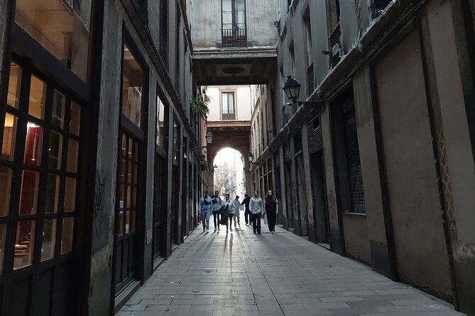 Barcelona Tour And Photoshoot in Gothic Quarter - Roman columns in a quiet Jewish Quarter courtyard