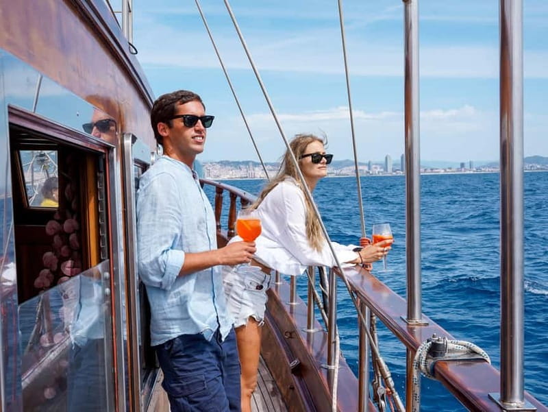 Barcelona: Wooden Boat Sailing with Tapa and Welcome Drink - Music, drinks, and the mood on board
