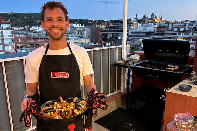 BBQ Paella in a Penthouse Terrace in Barcelona with a Chef - Watching Victor build the charcoal paella