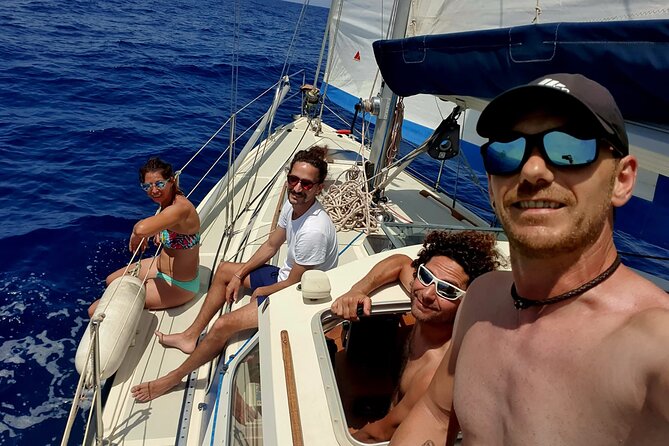 Boat Tour with Drink and Picoteo, Barcelona - Paddleboard, fishing rod, and swimming