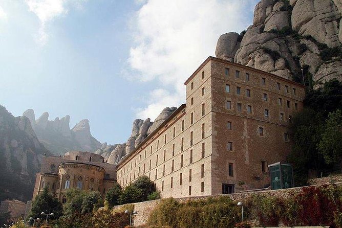 Montserrat Day Trip Private or Small Group with Basilica Tickets - The Montserrat market and Catalan tastes