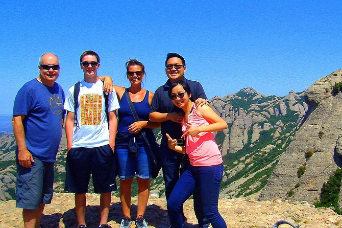 Montserrat Half Day with Cable Car and Easy Hike from Barcelona - Walking from the mountain top toward the monastery