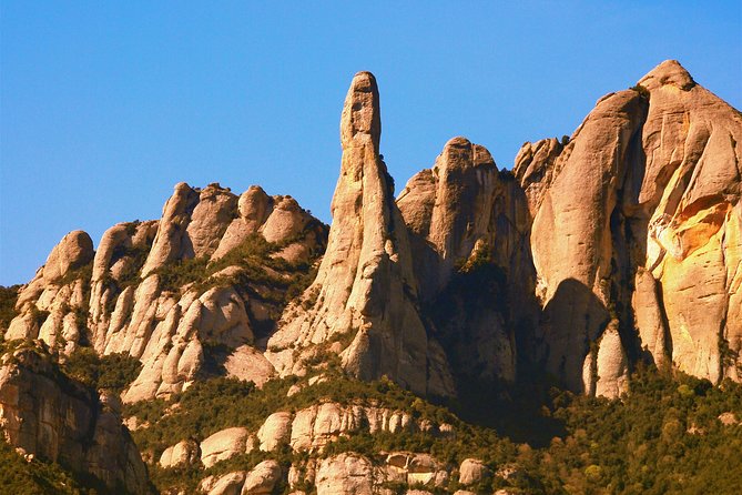 Montserrat Half Day with Cable Car and Easy Hike from Barcelona - Booking, cancellation, and practical details