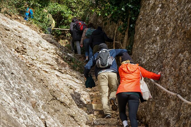 Montserrat Land of Shrines - One Day Small Group Hiking Tour from Barcelona - Riding the Sant Joan funicular uphill