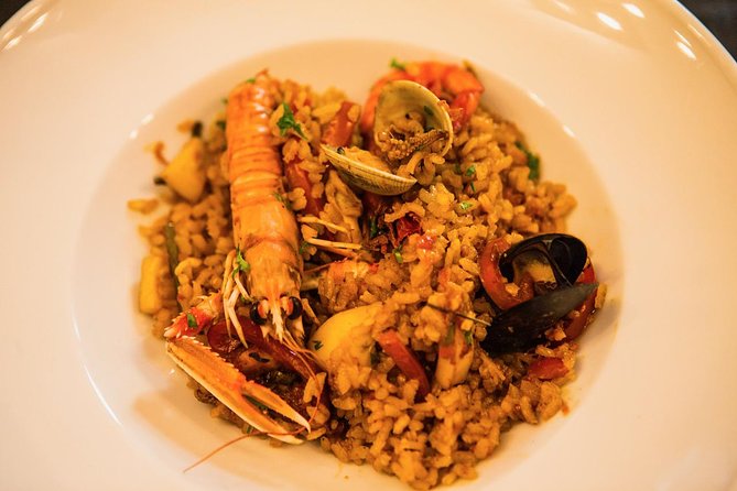 Private Authentic Paella Cooking Class in Barcelona with Josh - Starting with fruit, sangria, and conversation