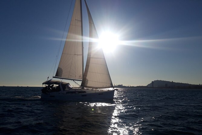 Private sailing and paddlesurfing tour with skipper up to 11 people - Port Vell: old docks, yachts, and working harbor views