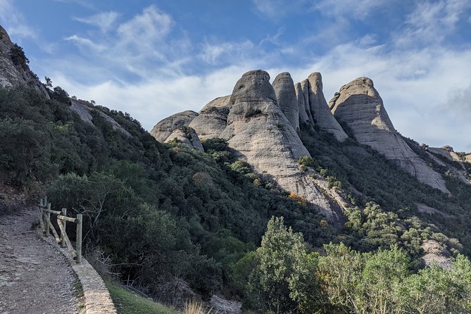 Semi-Private Montserrat Monastery, Funicular & Scenic Nature Walk - Walking downhill through Montserrat Natural Park